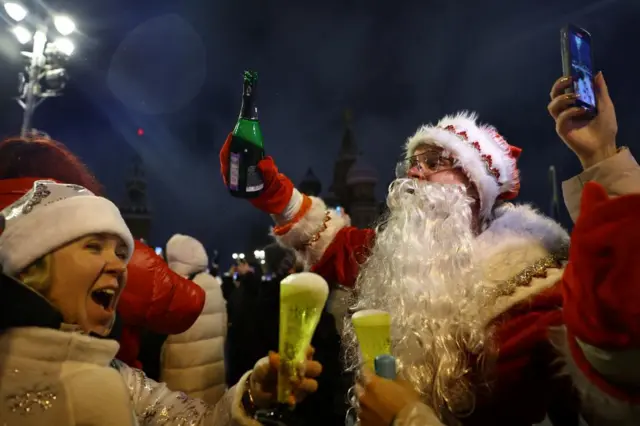 People react as they take part in New Year celebrations in central Moscow, Russia, January 1, 2025.