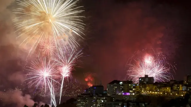 Fireworks light up the coast of Valparaiso Bay and Vina del Mar, to celebrate the new year in Valparaiso, Chile