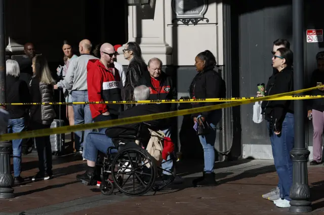Georgia fans at the intersection of Canal and Bourbon Street in New Orleans, cordoned off with police tape