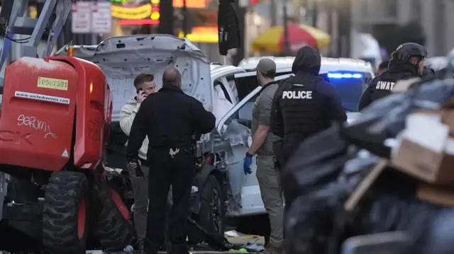 Emergency services attend the scene on Bourbon Street in daylight