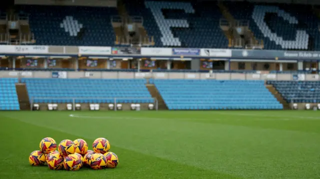 Footballs on the pitch before the League One match at Adams Park