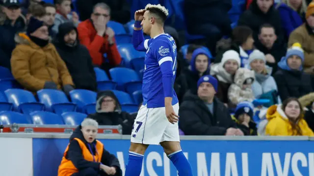 Cardiff's Callum Robinson leaves the pitch following his red card