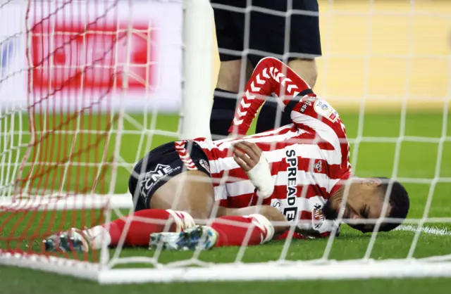 Sunderland's Wilson Isidor reacts to an injury