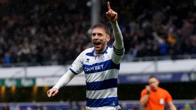 Sam Field places his finger in the air after scoring QPR's third against Watford