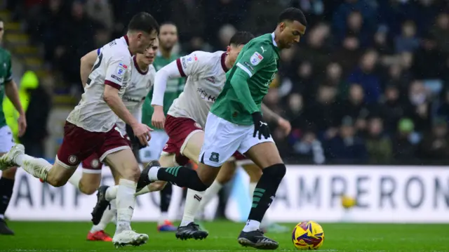 Plymouth forward Morgan Whittaker accelerates away from the Bristol City midfielder