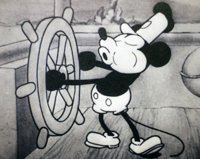 In this photo illustration, a still from Disney's 'Steamboat Willie' that was the debut of Mickey Mouse is seen in a book on January 05, 2024 in Los Angeles, California