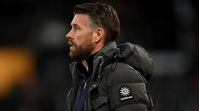 Luton manager Rob Edwards looks on