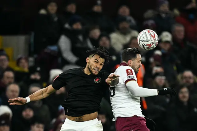 Danny Ings heads the ball