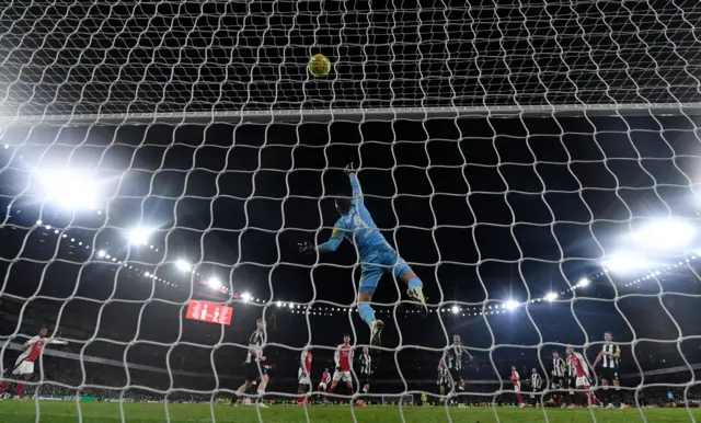 Newcastle goalkeeper Martin Dubravka tips over an Arsenal chance