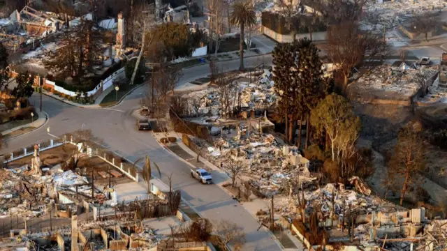 Aerial view of a neighbour with burnt houses and some trees