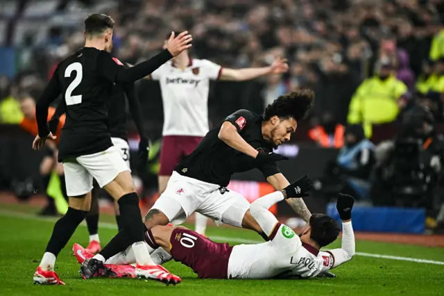 Boubacar Kamara (L) falls over Lucas Paqueta