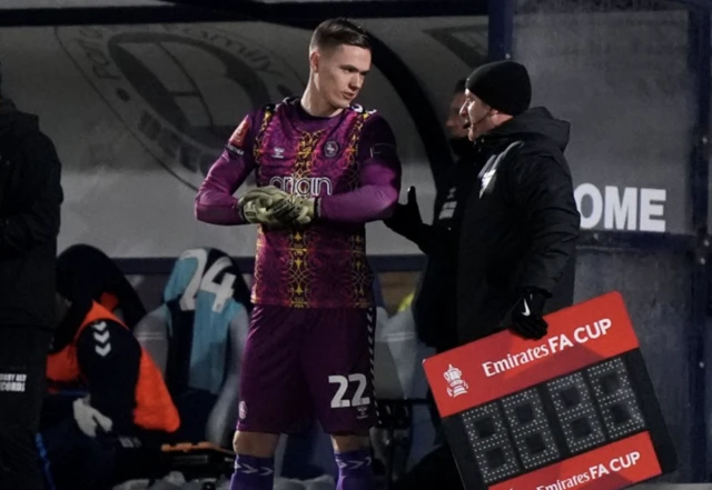 Wycombe Wanderers goalkeeper Nathan Bishop replaces team-mate Shamal George