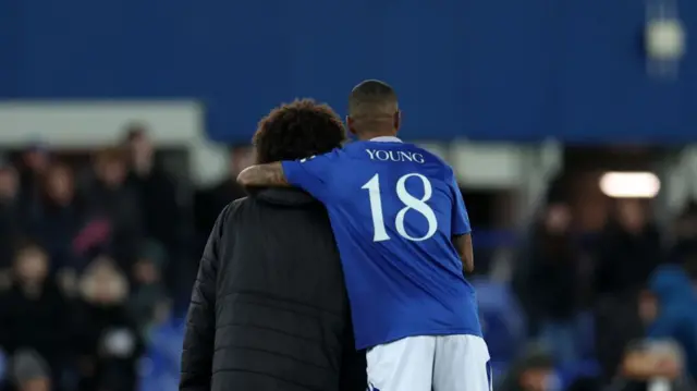 Ashley Young hugs his son Tyler