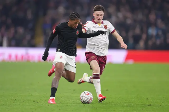 Leon Bailey of Aston Villa and Ollie Scarles