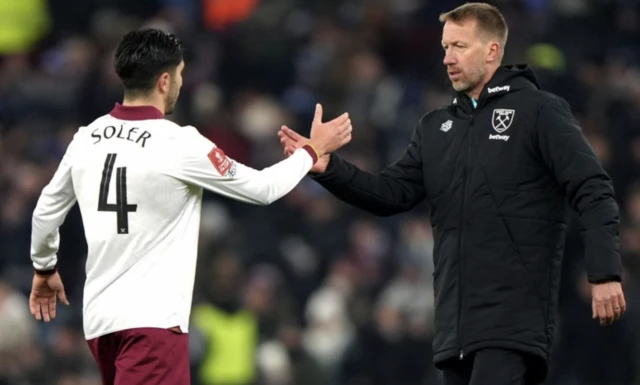 West Ham United manager Graham Potter (right) shake hands with player Carlos Soler