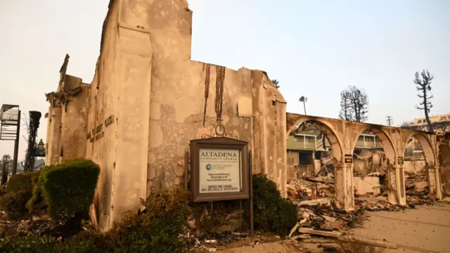 The remains of Altadena Community Church after the wildfires. The centre caved in on itself, only the external walls and columns still standing