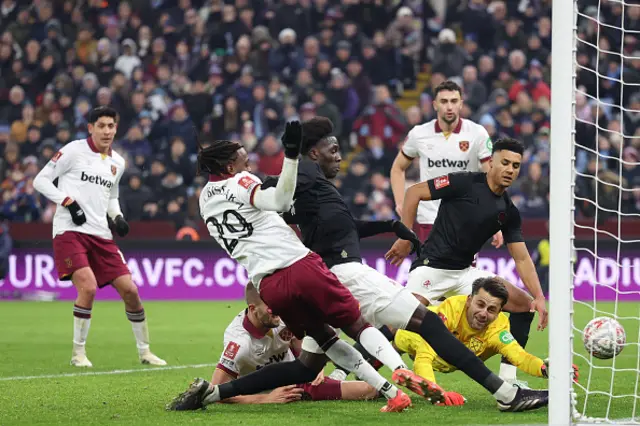 Amadou Onana of Aston Villa scores