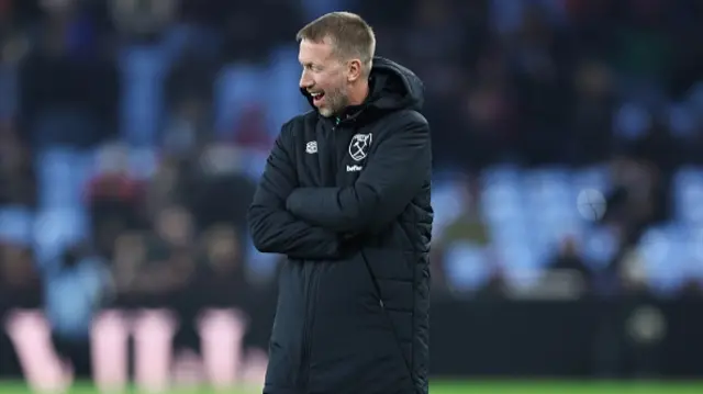 Graham Potter, head coach of West Ham United, looks on