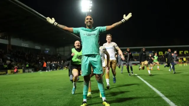 Jasbir Singh of Tamworth celebrates winning a penalty shootout to reach the FA Cup Third Round