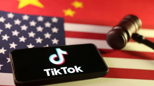 U.S., Chinese flags, TikTok logo and gavel are seen in this illustration