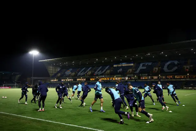 A general view inside the stadium as the players of Wycombe Wanderers warm up