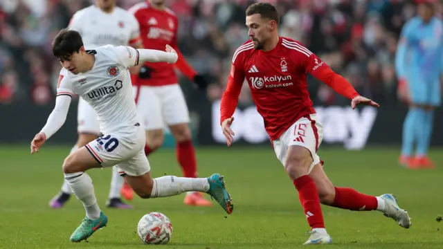 Luton Town's Liam Walsh in action with Nottingham Forest's Harry Toffolo