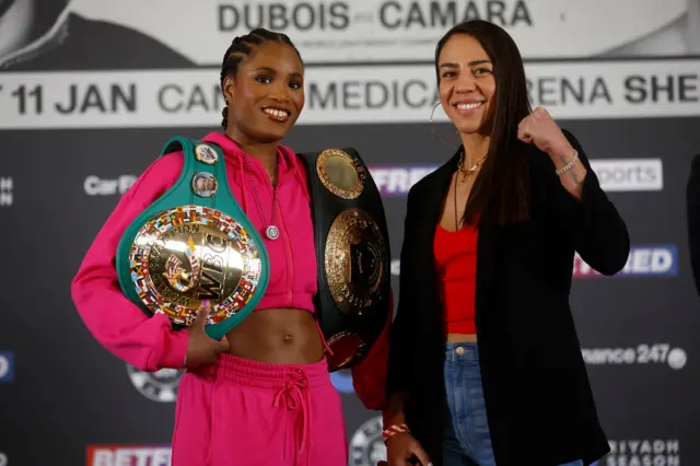 Caroline Dubois holds her world title next to Jessica Camara