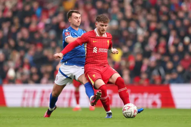 Harvey Elliott battles for the ball against Accrington Stanley