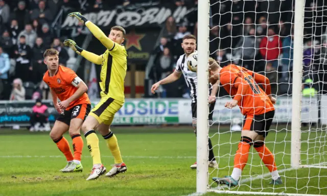 United's Luca Stephenson clears off the line