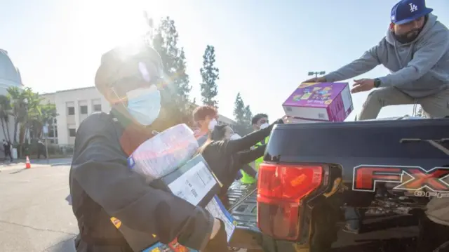 Volunteers unloading aid from a truck