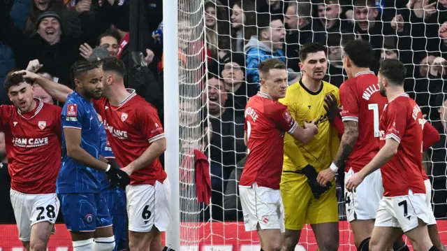 Morecambe's Harry Burgoyne celebrates with teammates