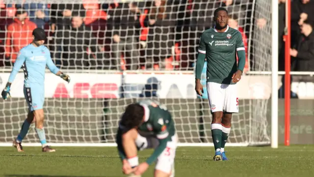 Bolton defender Ricardo Santos reacts after conceding a penalty