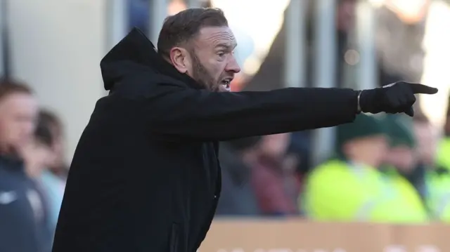 Bolton manager Ian Evatt shouts instructions to his players