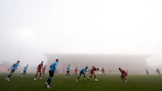 Match action between Swindon and Crewe before play was suspended