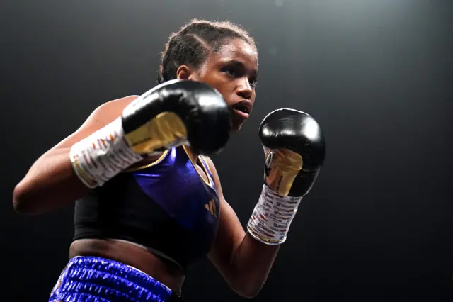 Caroline Dubois holds up her boxing gloives