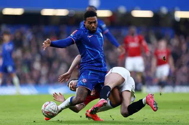 Reece James of Chelsea is challenged by Gwion Edwards