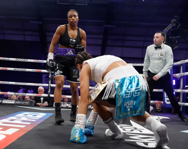 Caroline Dubois stands over Jessica Camara after knocking her down