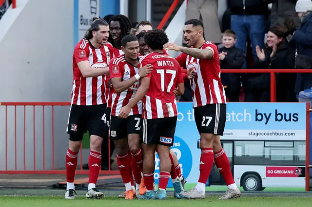 Demi Mitchell of Exeter City celebrates with teammates