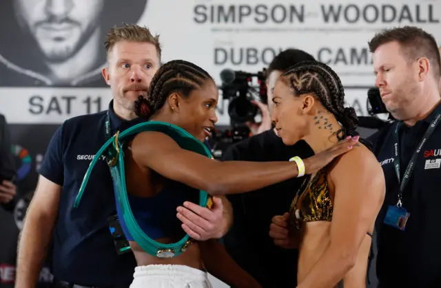 Caroline Dubois puts her hand on Jessica Camara's shoulder during a face-off