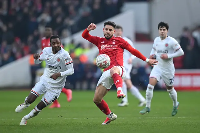 Alex Moreno of Nottingham Forest controls the ball