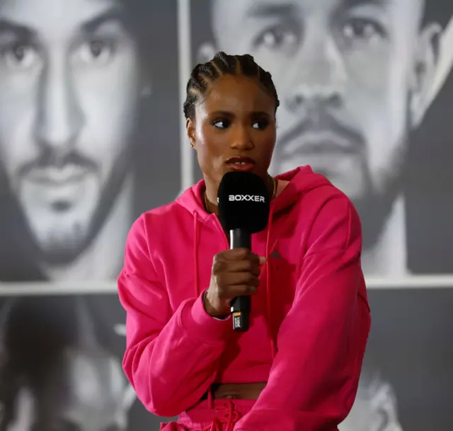 Caroline Dubois speaking into a microphone