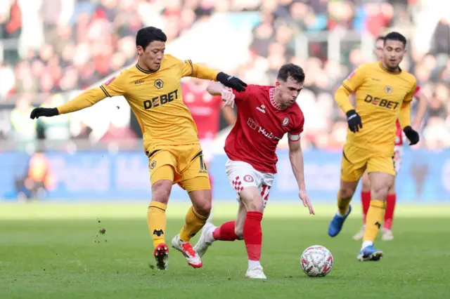 Bristol City midfielder Jason Knight battles with Hwang Hee-chan