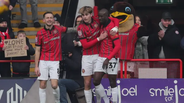 Walsall's Nathan Lowe (centre) celebrates scoring against Tranmere