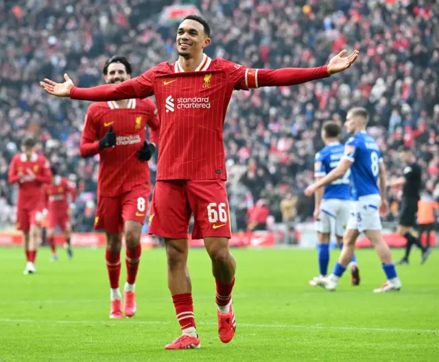 Trent Alexander-Arnold celebrates after scoring