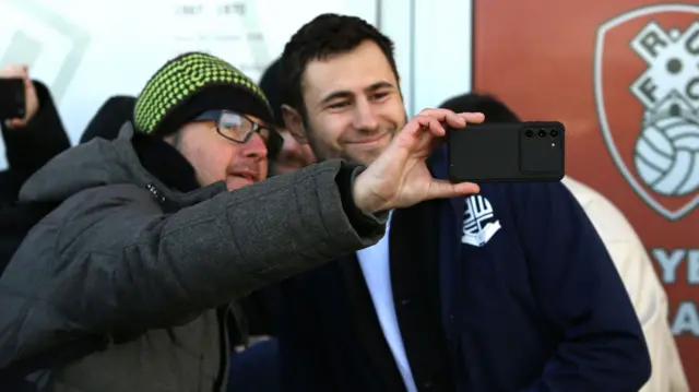 Bolton's Nathan Baxter poses for a selfie with a fan