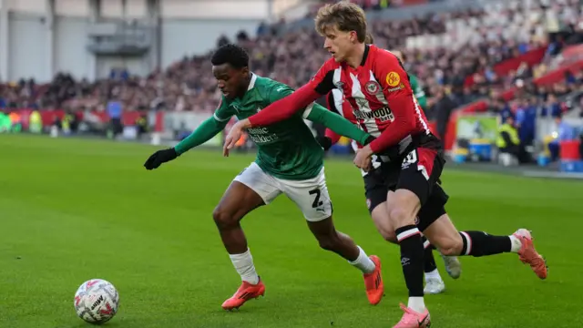 Plymouth Argyle's Bali Mumba (left) and Brentford's Mads Roerslev battle for the ball