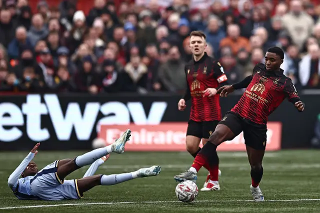 eck-Ray Enoru (R) vies with Tottenham Hotspur's Senegalese striker Pape Matar Sarr