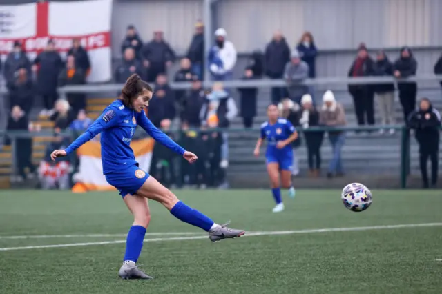 Nicky Potts of Rugby Borough scores her team's first goal.