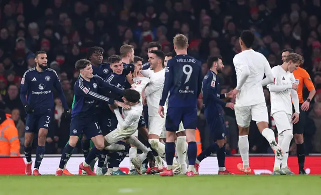 Kai Havertz of Arsenal clashes with Alejandro Garnacho