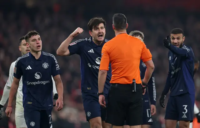 Harry Maguire of Manchester United reacts towards referee Andrew Madley